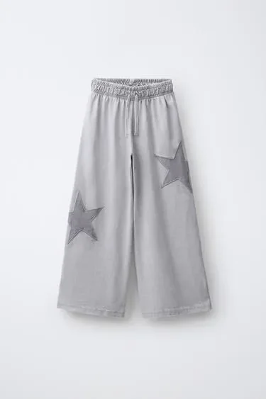 Zara Брюки  с эффектом потертости и звездами